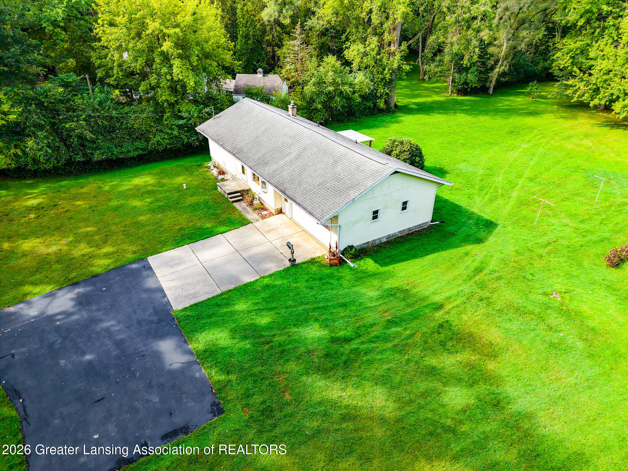 4497 Meridian Road Okemos, MI 48864 - Photo 30 of 58 DJI_20260910110738_0009_D