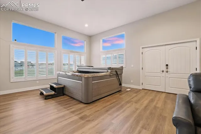 a kitchen with sink cabinets and wooden floor