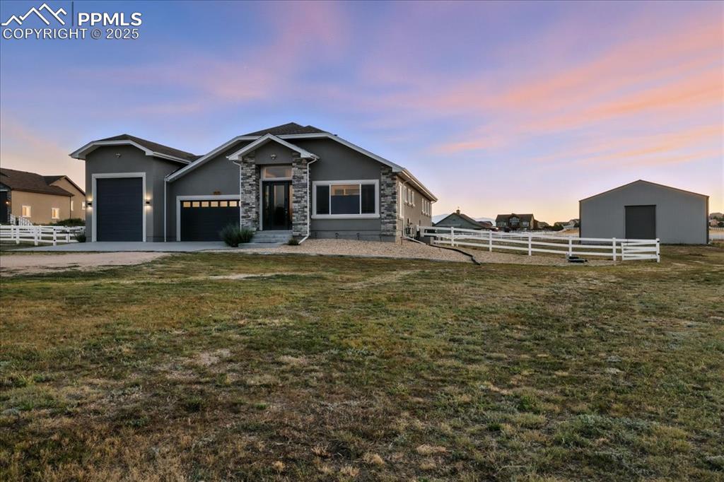 11970 Silver Concho Trail Elbert, CO 80106 - Photo 2 of 44 a front view of a house with a yard
