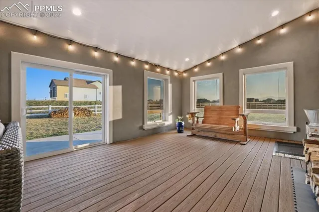 a spacious bedroom with a large bed and a large window