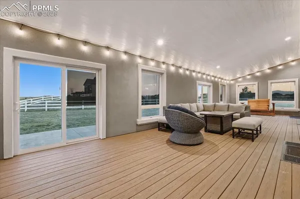 a room with lots of chairs and wooden floor