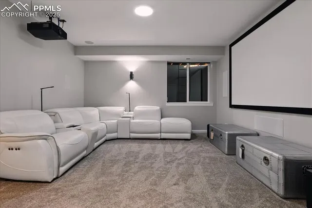 a living room with furniture and a lamp