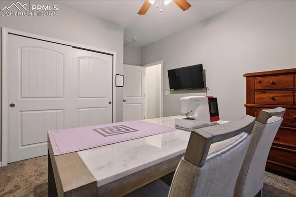 a view of a workspace with furniture