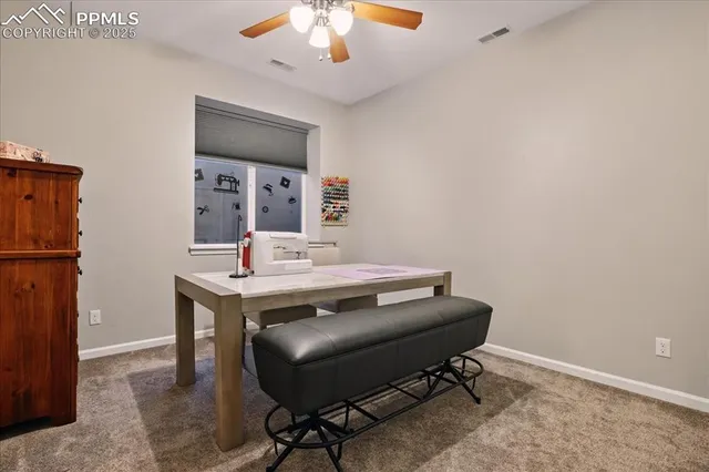 a view of a workspace with furniture