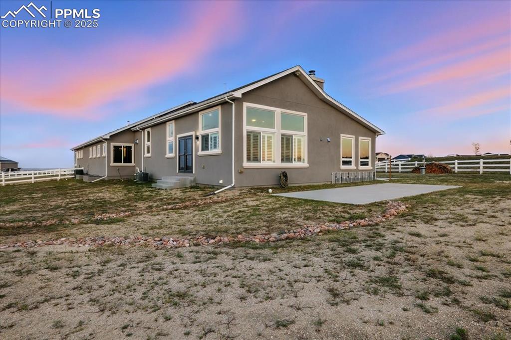 11970 Silver Concho Trail Elbert, CO 80106 - Photo 41 of 44 a front view of a house with a yard