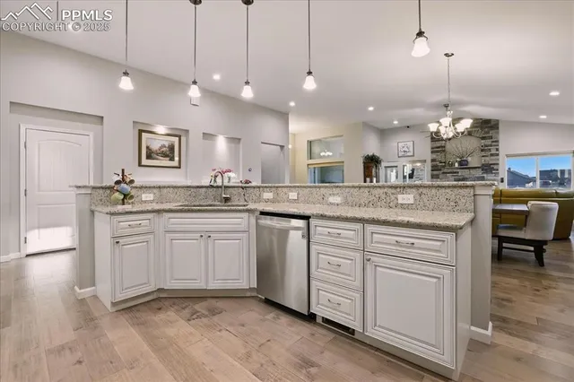 a kitchen with a sink stove and cabinets