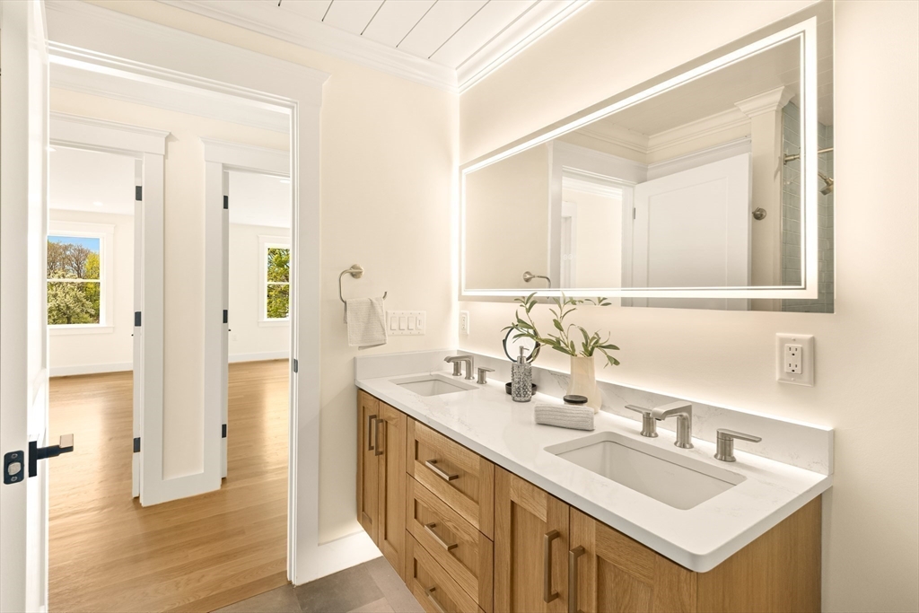3 Colburn Street, Unit 1 Gloucester, MA 01930 - Photo 31 of 42 a bathroom with a sink double vanity and a mirror