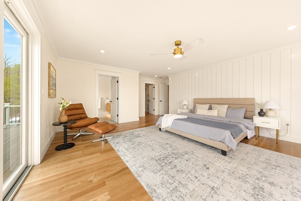 3 Colburn Street, Unit 1 Gloucester, MA 01930 - Photo 35 of 42 a spacious bedroom with a bed and wooden floor