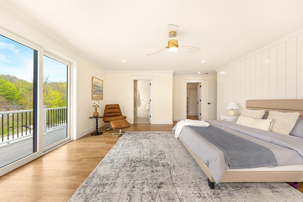 3 Colburn Street, Unit 1 Gloucester, MA 01930 - Photo 36 of 42 a spacious bedroom with a bed and large windows