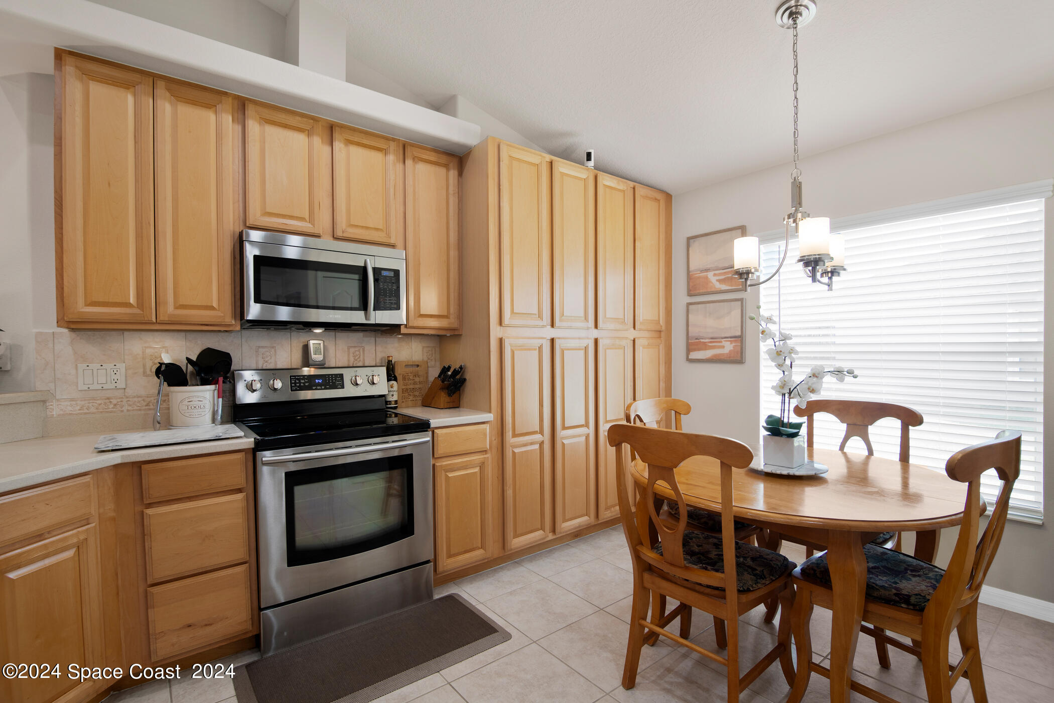 3412 Siderwheel Drive Rockledge, FL 32955 - Photo 14 of 39 a kitchen with a stove a sink and appliances