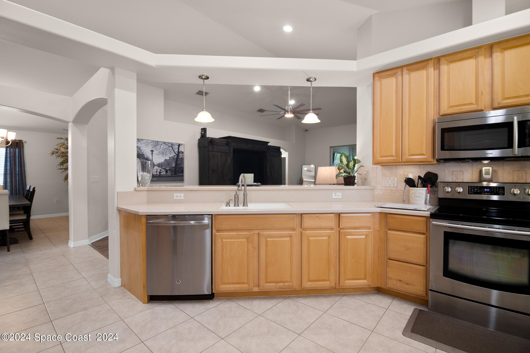 3412 Siderwheel Drive Rockledge, FL 32955 - Photo 15 of 39 a large kitchen with stainless steel appliances and cabinets