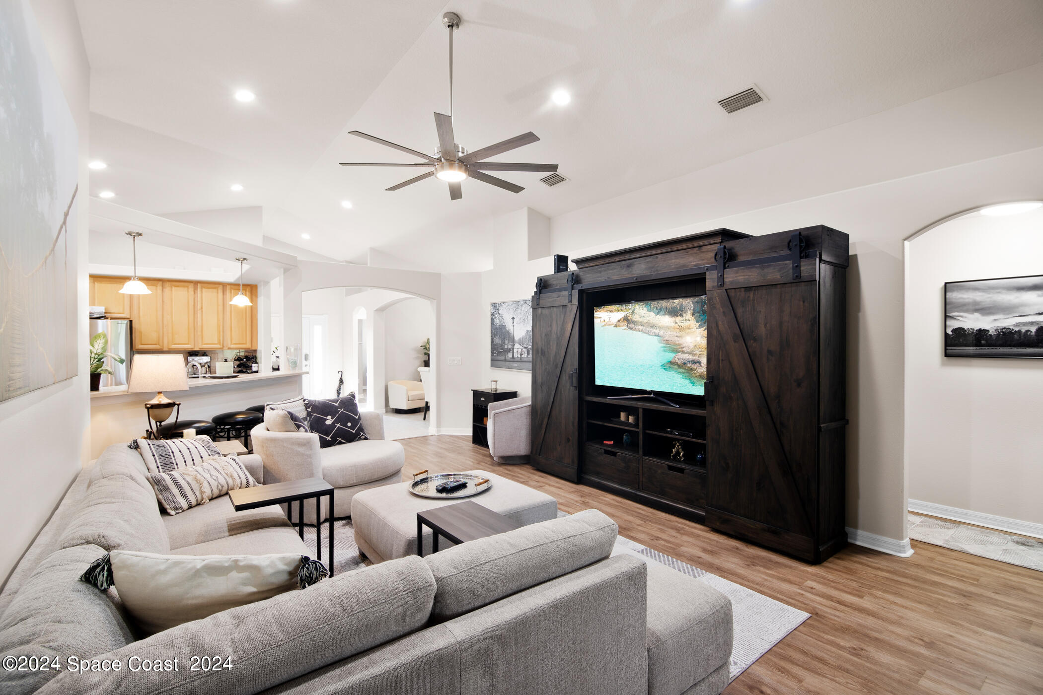 3412 Siderwheel Drive Rockledge, FL 32955 - Photo 18 of 39 a living room with furniture and a flat screen tv