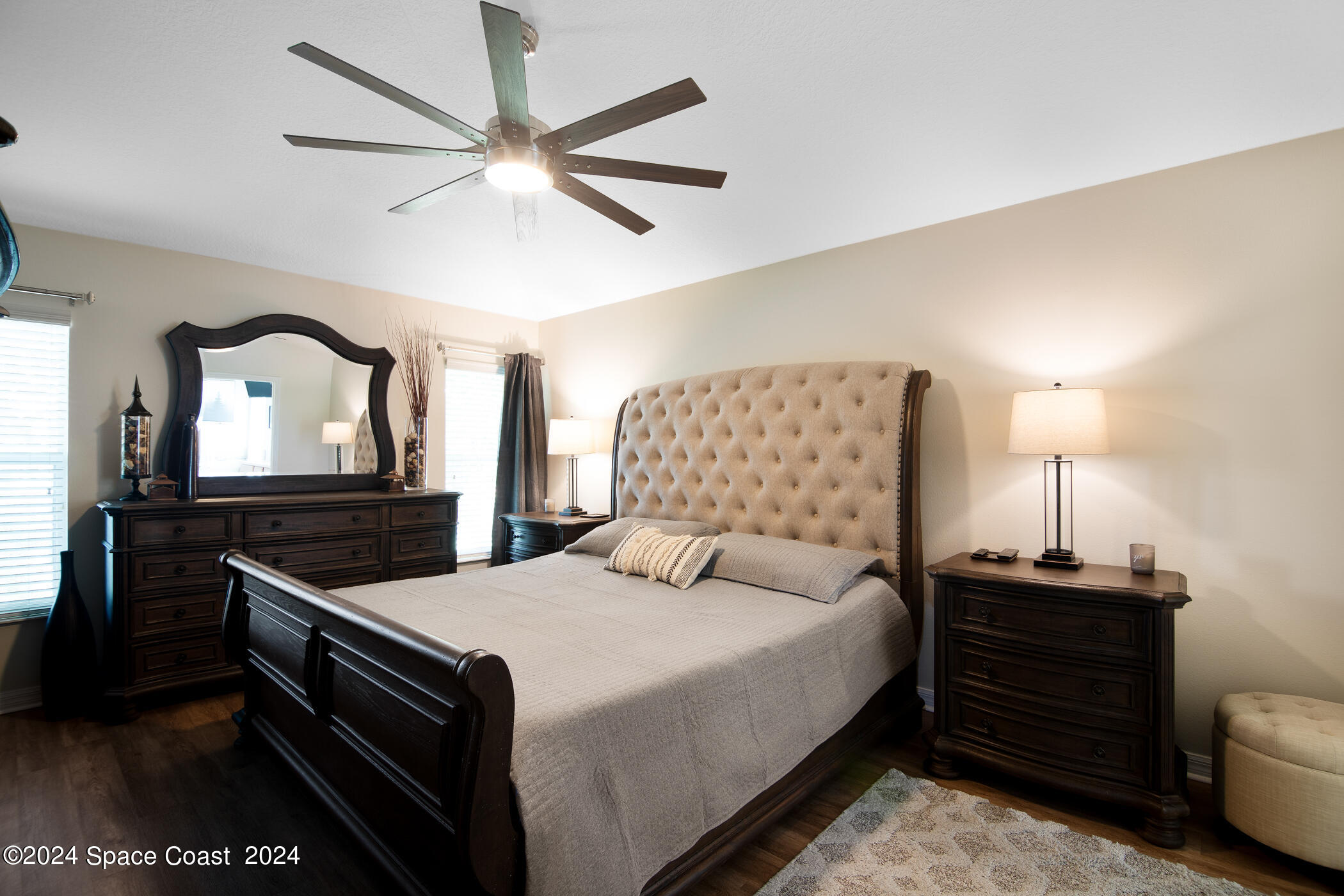 3412 Siderwheel Drive Rockledge, FL 32955 - Photo 19 of 39 a bedroom with a bed and a dresser with the potted plant