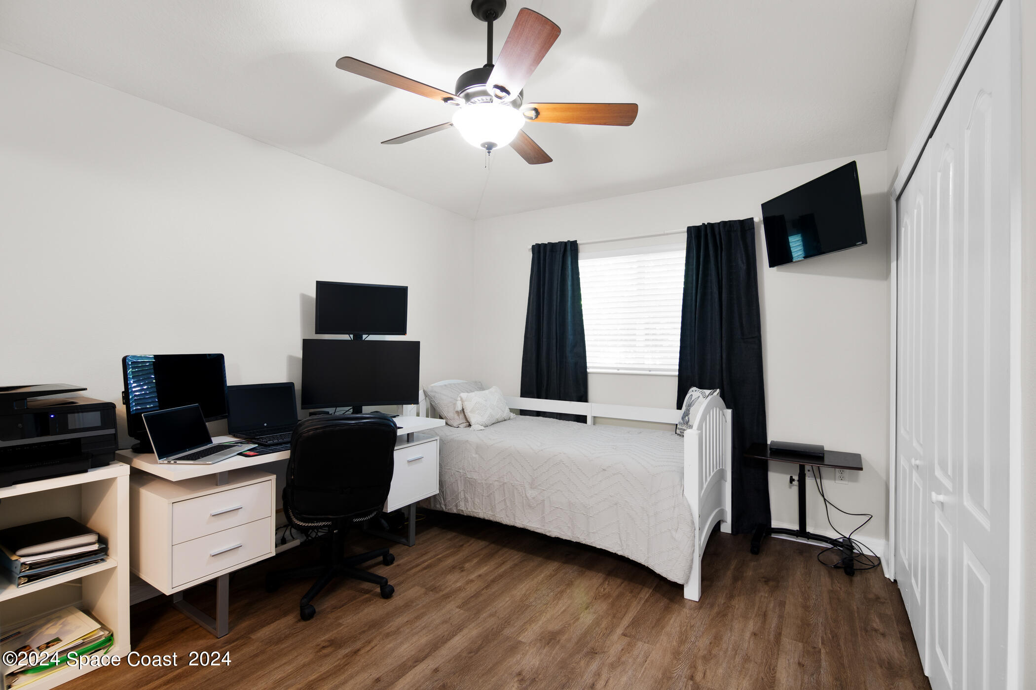 3412 Siderwheel Drive Rockledge, FL 32955 - Photo 22 of 39 a bedroom with a bed and a flat screen tv