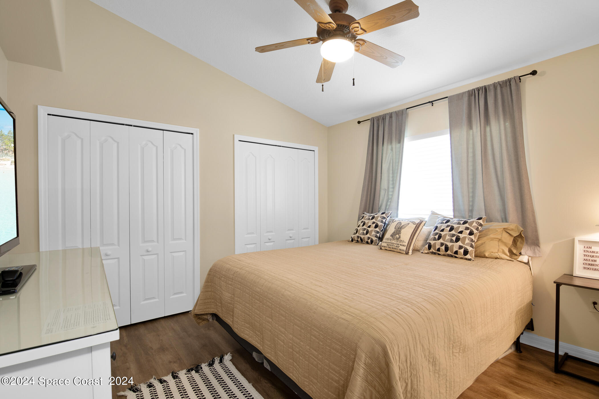 3412 Siderwheel Drive Rockledge, FL 32955 - Photo 24 of 39 a bedroom with a large bed and a chandelier