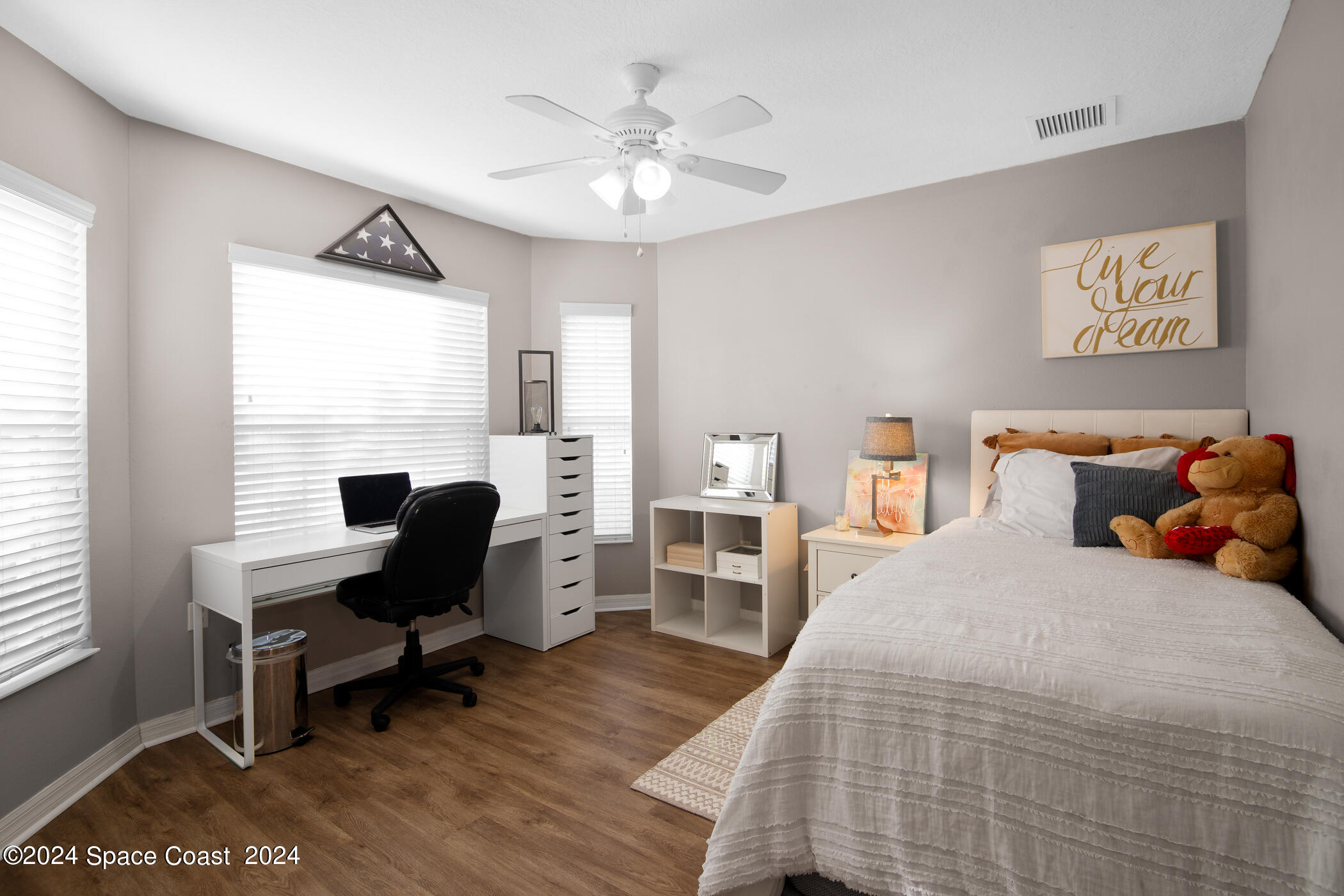 3412 Siderwheel Drive Rockledge, FL 32955 - Photo 25 of 39 a bedroom with a bed and a desk