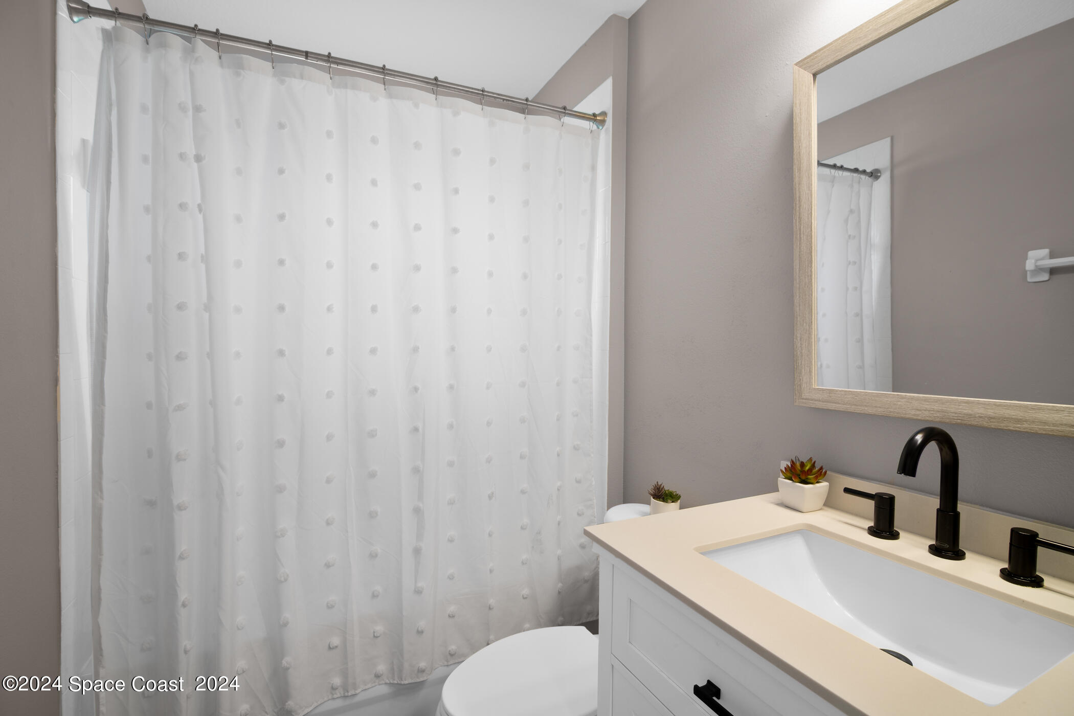 3412 Siderwheel Drive Rockledge, FL 32955 - Photo 26 of 39 a bathroom with a sink and a vanity