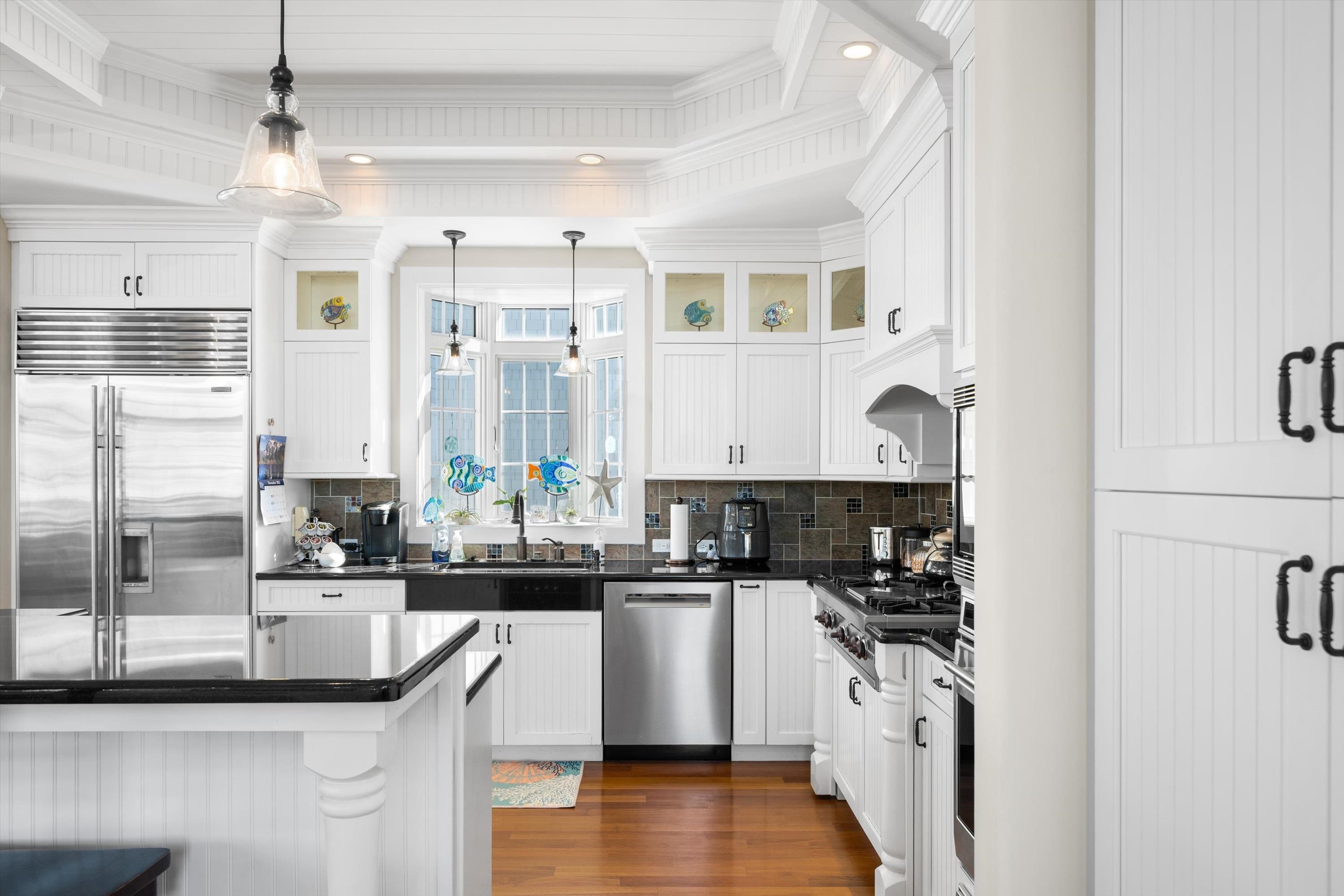 8600 2nd Stone Harbor, NJ 08247 - Photo 14 of 45 a kitchen with stainless steel appliances granite countertop a sink and cabinets