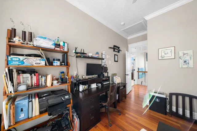 a living room with lots of furniture and a book shelf