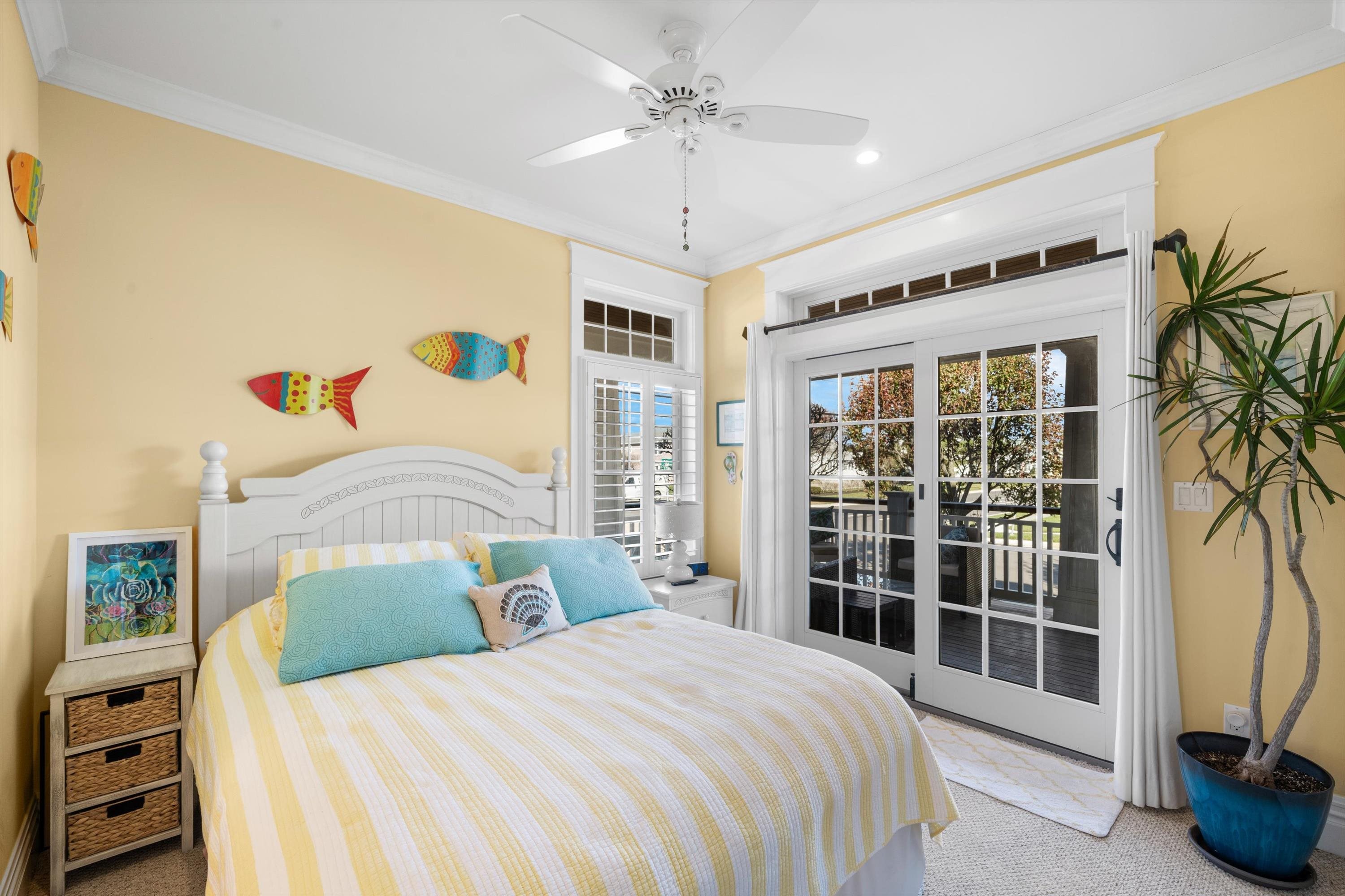8600 2nd Stone Harbor, NJ 08247 - Photo 26 of 45 a bedroom with a large bed and a chandelier