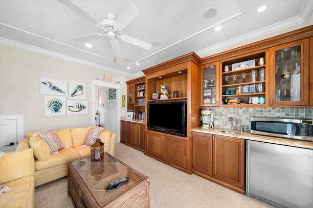 a living room with fireplace furniture and a flat screen tv
