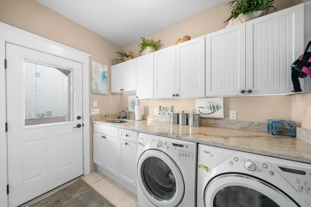 a view of a kitchen with washer and dryer