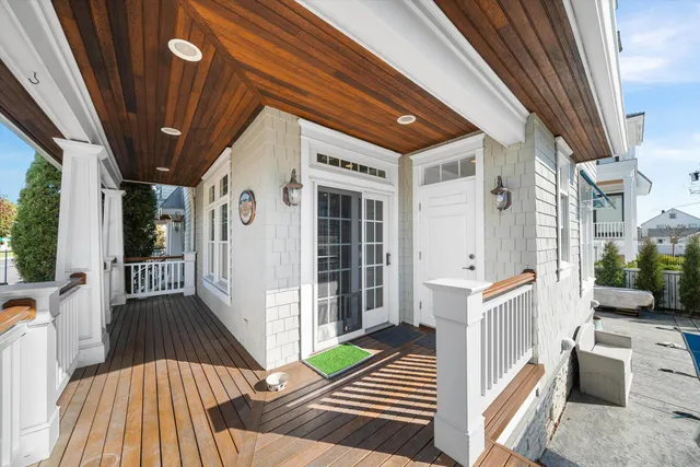 a view of a porch with wooden floor