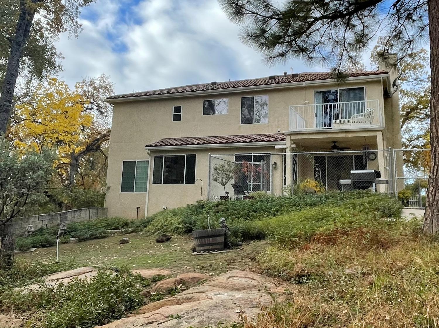 34811 Wintergreen Loop North Fork, CA 93643 - Photo 2 of 18 a front view of a house with garden