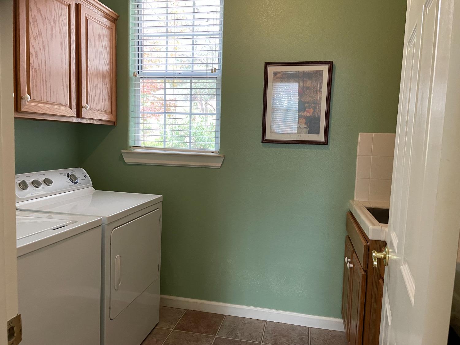 34811 Wintergreen Loop North Fork, CA 93643 - Photo 9 of 18 a utility room with a window dryer and washer
