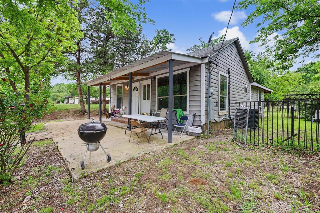 205 South Main Street Bonham, TX 75418 - Photo 2 of 23 a view of a house with backyard and sitting area