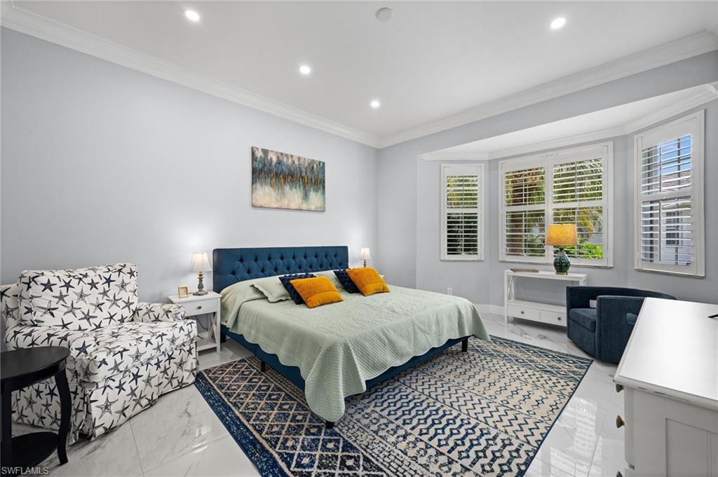 5010 Marina Cove Drive, Unit 4 Naples, FL 34112 - Photo 15 of 42 a bedroom with a bed and a window