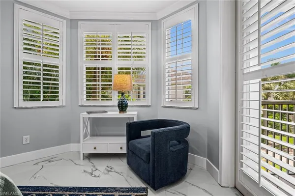 a living room with furniture and windows