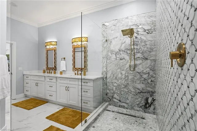 a bathroom with a double vanity sink mirror and shower