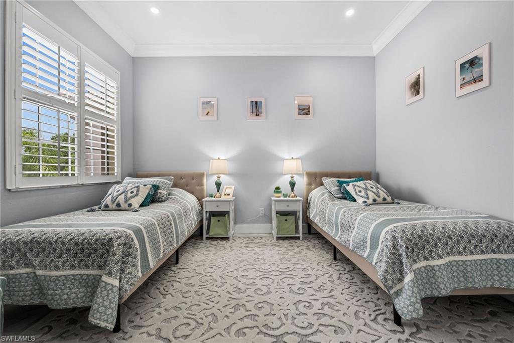 5010 Marina Cove Drive, Unit 4 Naples, FL 34112 - Photo 20 of 42 a bedroom with two beds and a window