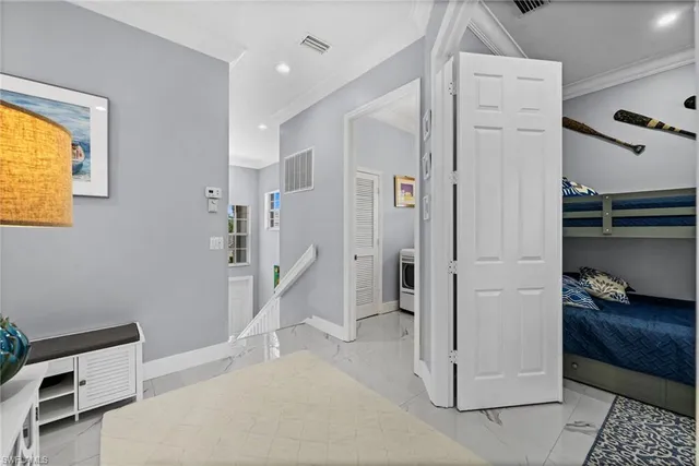 a view of a hallway with workspace and entryway