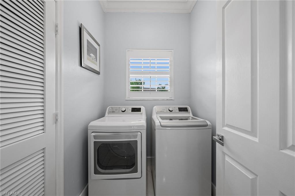 5010 Marina Cove Drive, Unit 4 Naples, FL 34112 - Photo 28 of 42 a utility room with dryer and washer