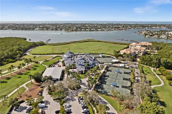 an aerial view of ocean with residential house and lake view