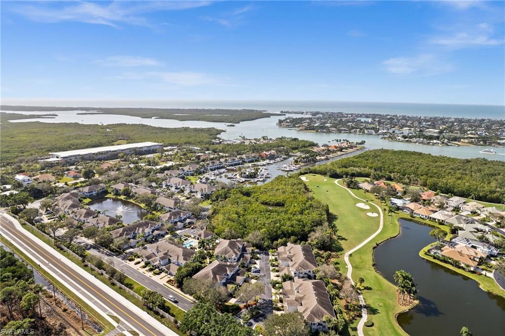 5010 Marina Cove Drive, Unit 4 Naples, FL 34112 - Photo 35 of 42 an aerial view of ocean and residential houses with outdoor space