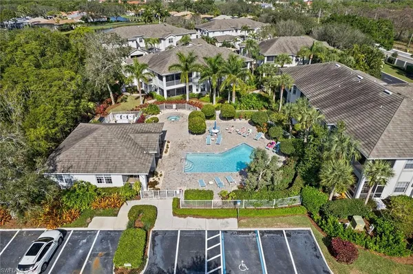 an aerial view of residential houses with yard