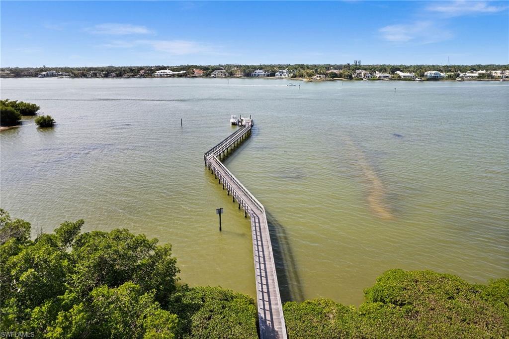 5010 Marina Cove Drive, Unit 4 Naples, FL 34112 - Photo 41 of 42 a view of a lake with sunset