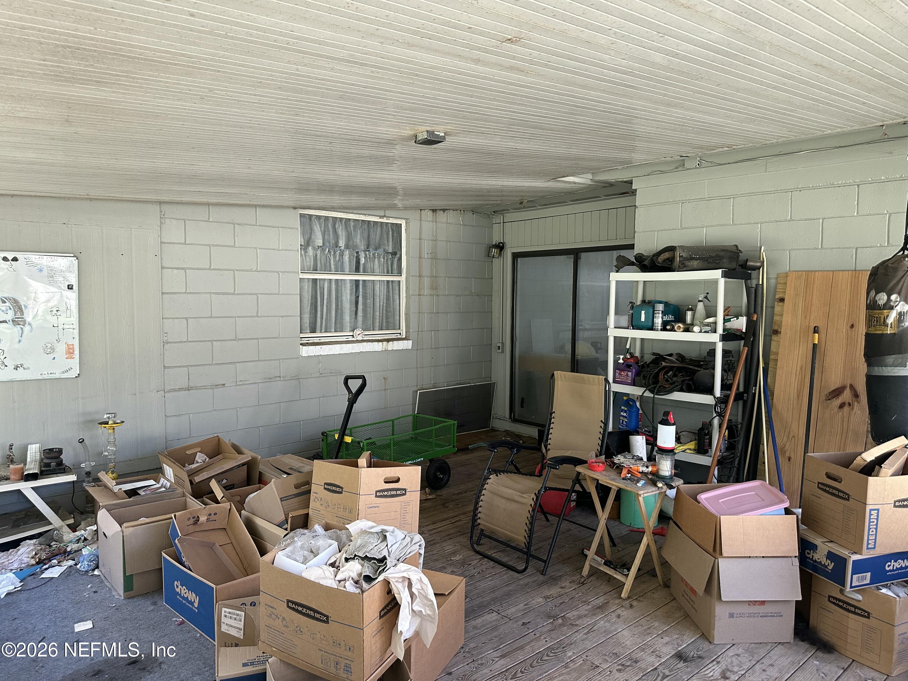 2351 Gaillardia Road Jacksonville, FL 32211 - Photo 16 of 19 a living room with furniture and a window