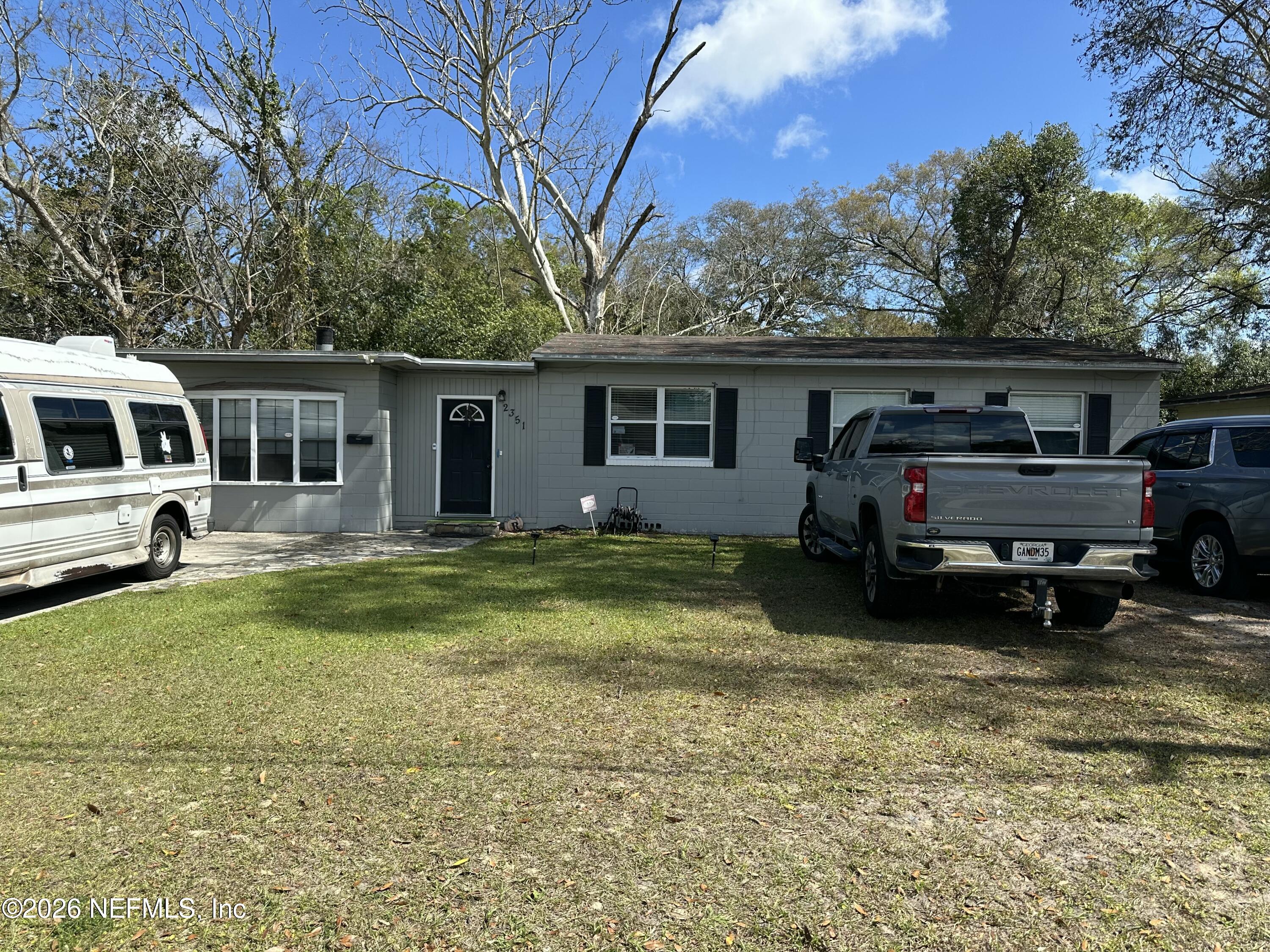 2351 Gaillardia Road Jacksonville, FL 32211 - Photo 2 of 19 a view of a house with a big yard and a large tree