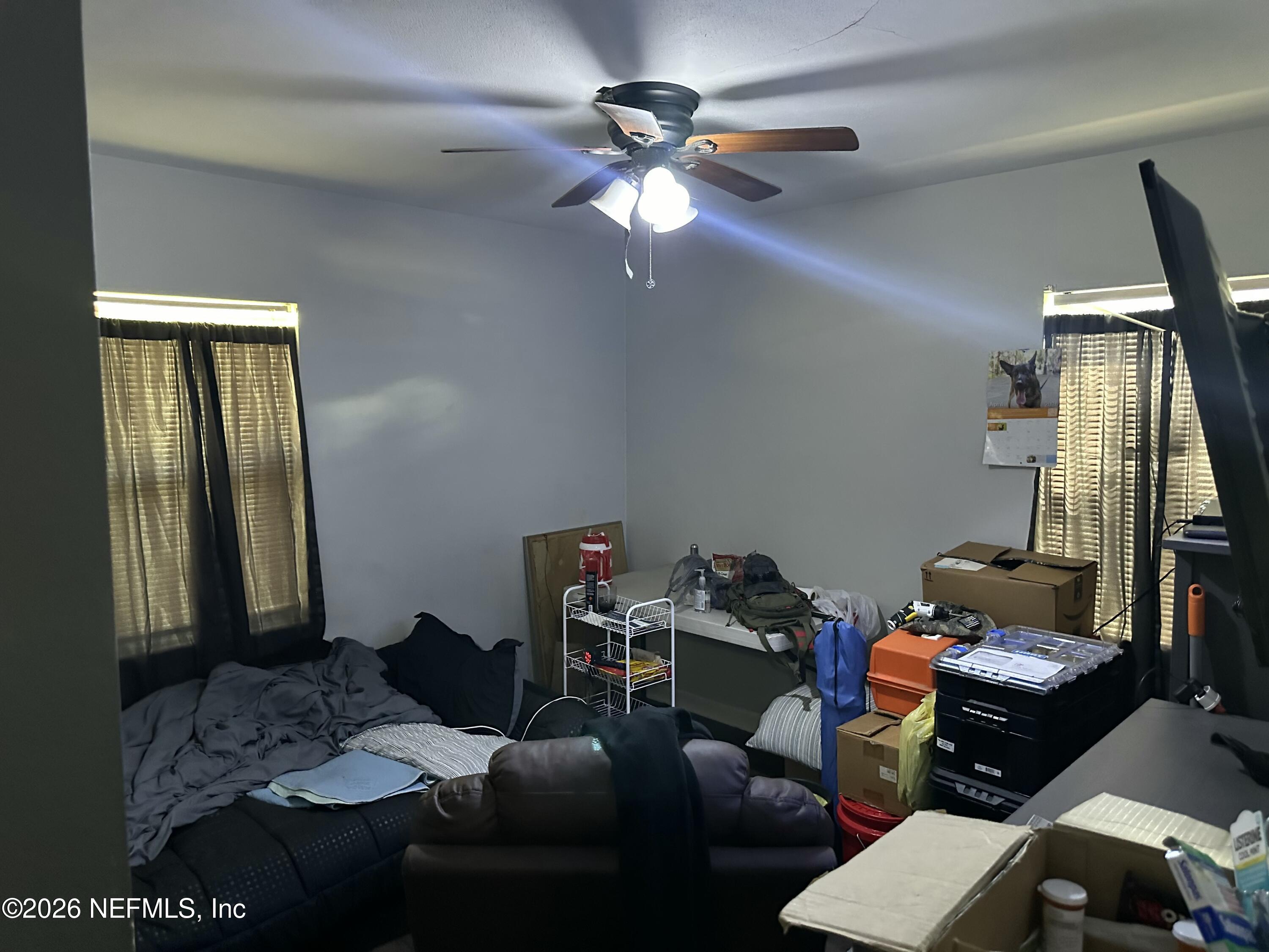 2351 Gaillardia Road Jacksonville, FL 32211 - Photo 6 of 19 a workspace with furniture and chandelier