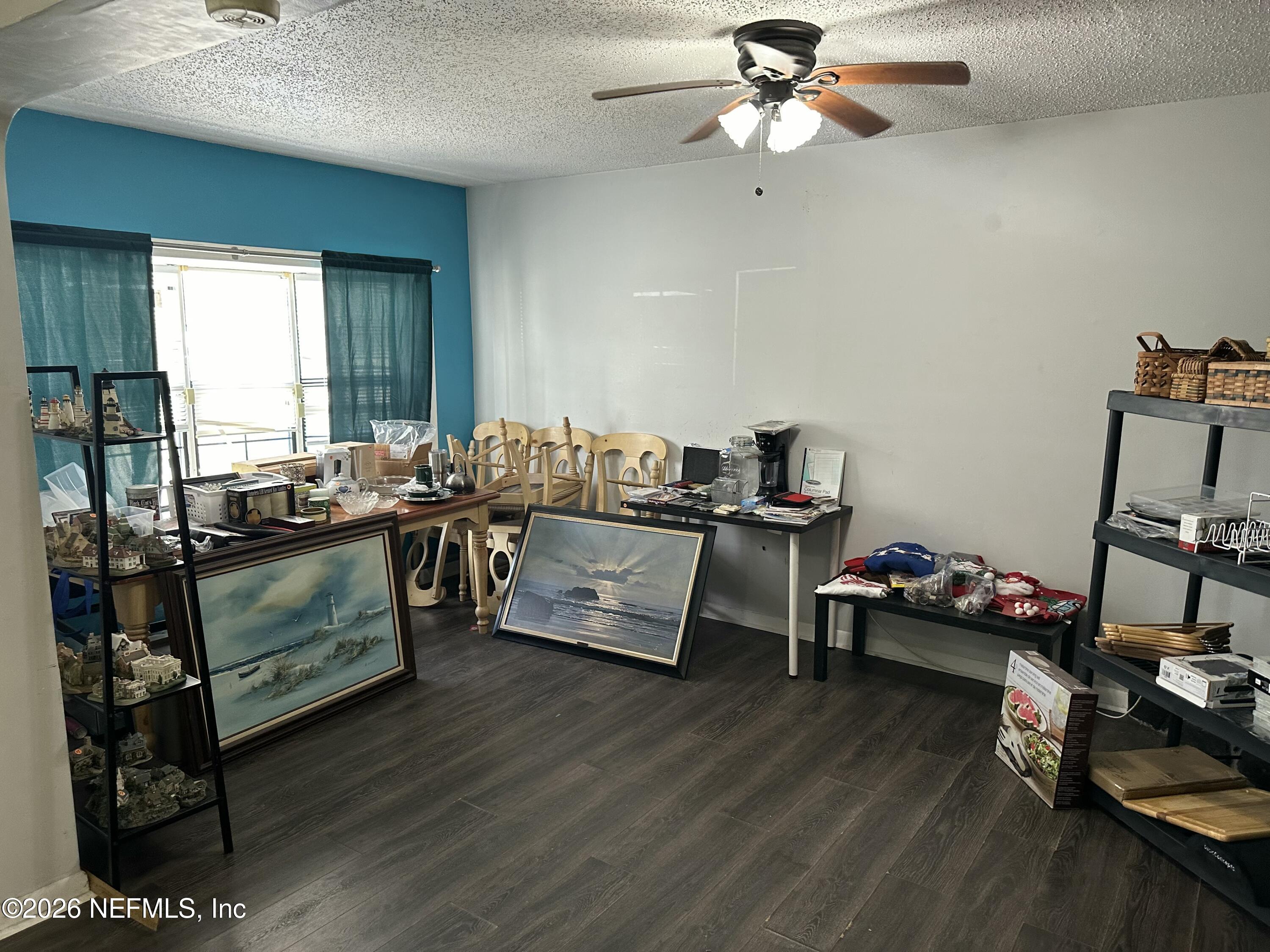 2351 Gaillardia Road Jacksonville, FL 32211 - Photo 7 of 19 a living room with furniture and a wooden floor