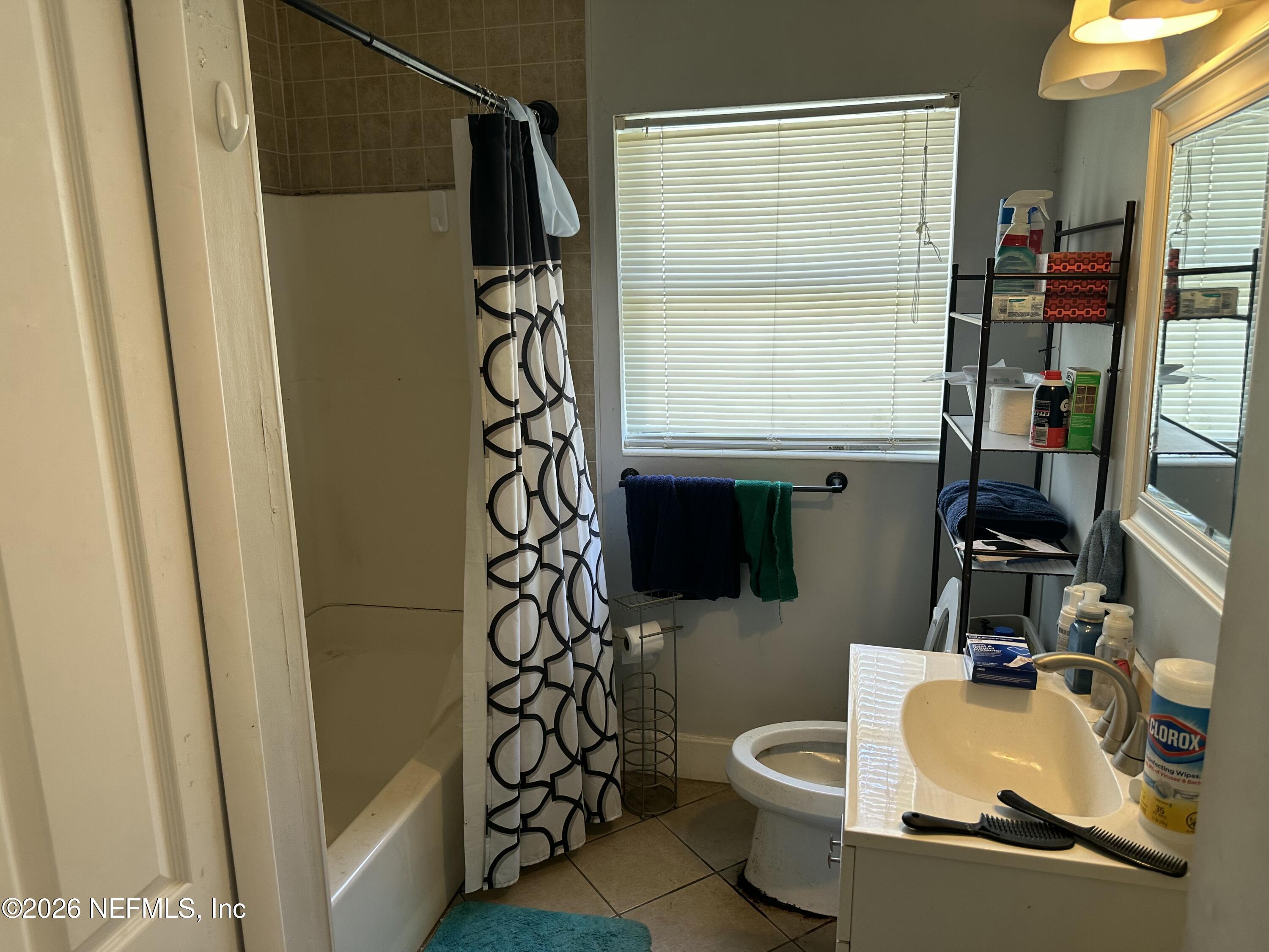 2351 Gaillardia Road Jacksonville, FL 32211 - Photo 10 of 19 a bathroom with a toilet and a shower