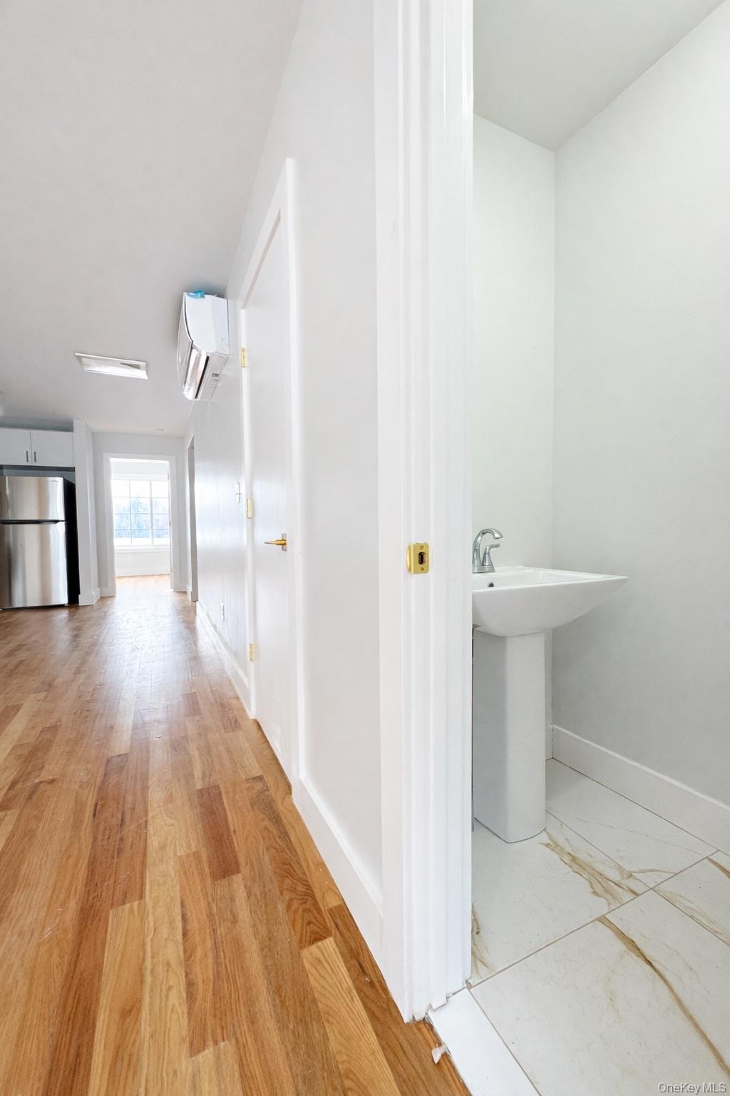 1140 Highway 52, Unit 5 Loch Sheldrake, NY 12759 - Photo 11 of 22 a view of a hallway with wooden floor