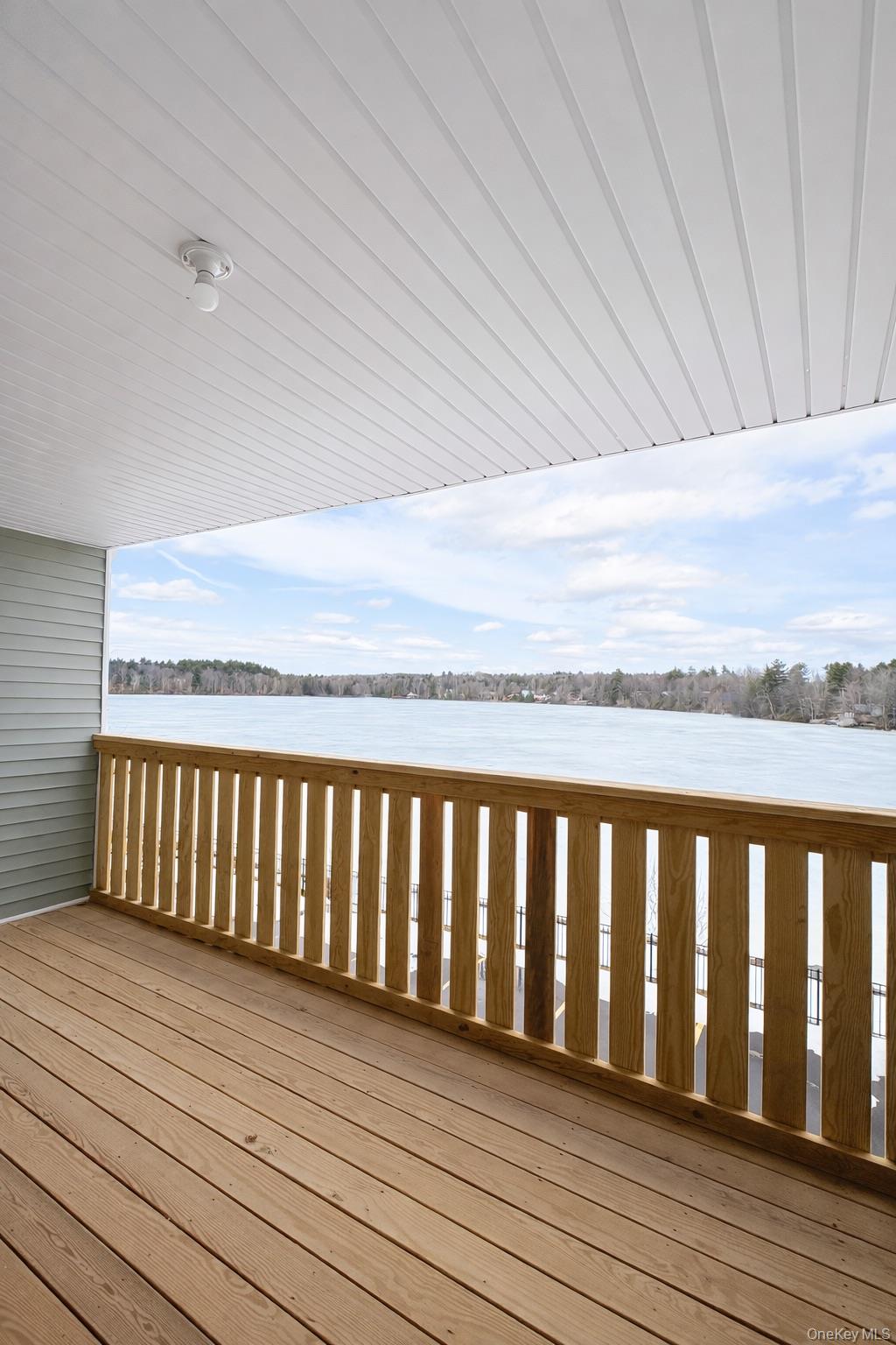 1140 Highway 52, Unit 5 Loch Sheldrake, NY 12759 - Photo 17 of 22 a balcony with wooden floor