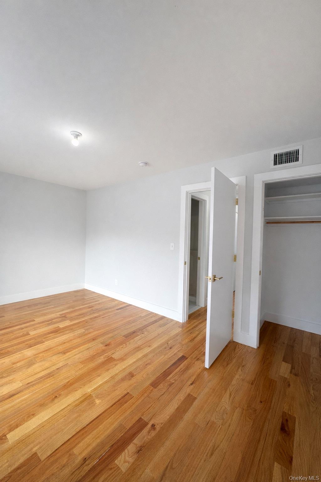1140 Highway 52, Unit 5 Loch Sheldrake, NY 12759 - Photo 19 of 22 a view of empty room with wooden floor