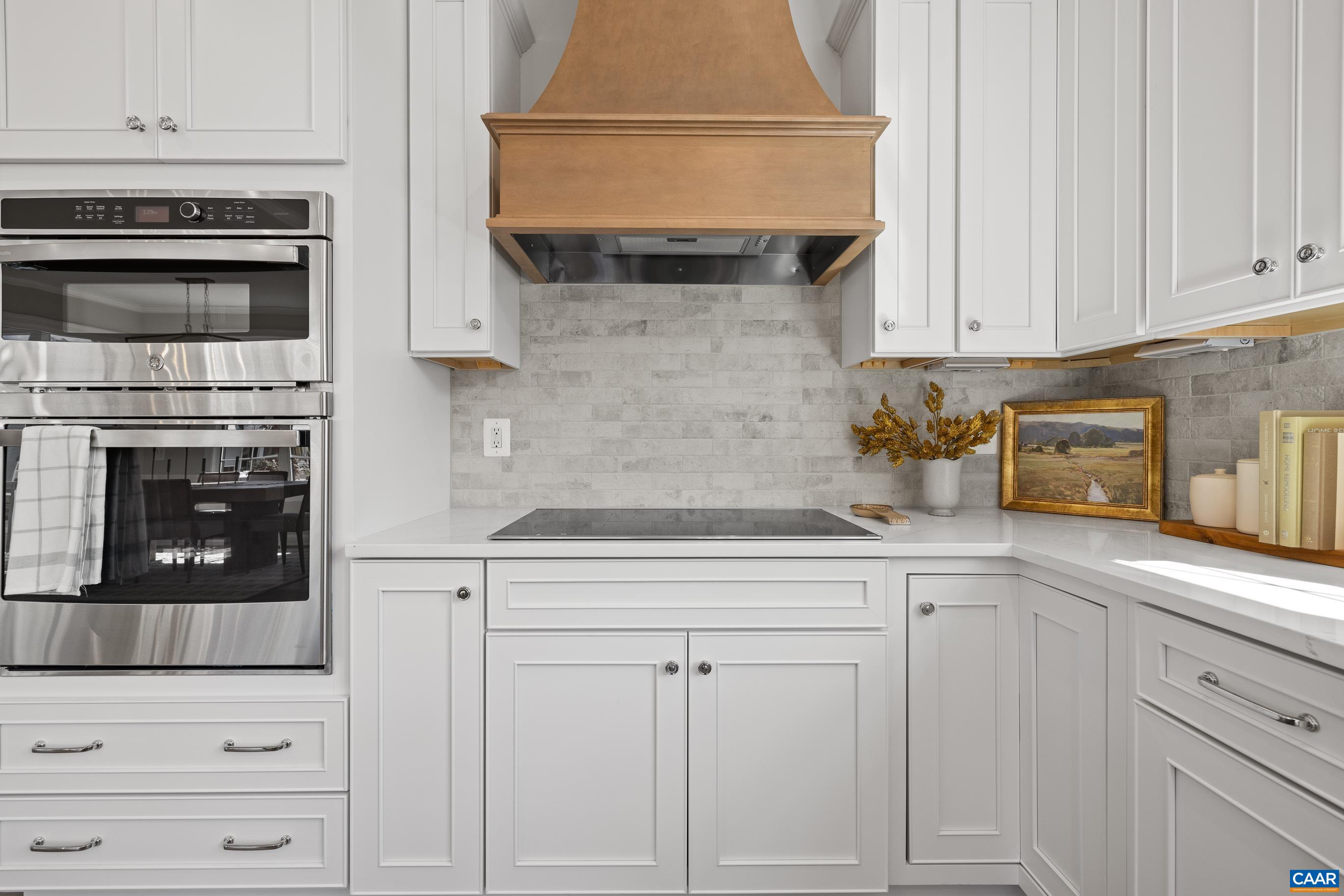 2 D Corsham Street Crozet, VA 22932 - Photo 26 of 44 a kitchen with white cabinets and appliances