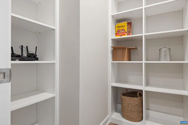 a view of kitchen island with furniture and wooden floor
